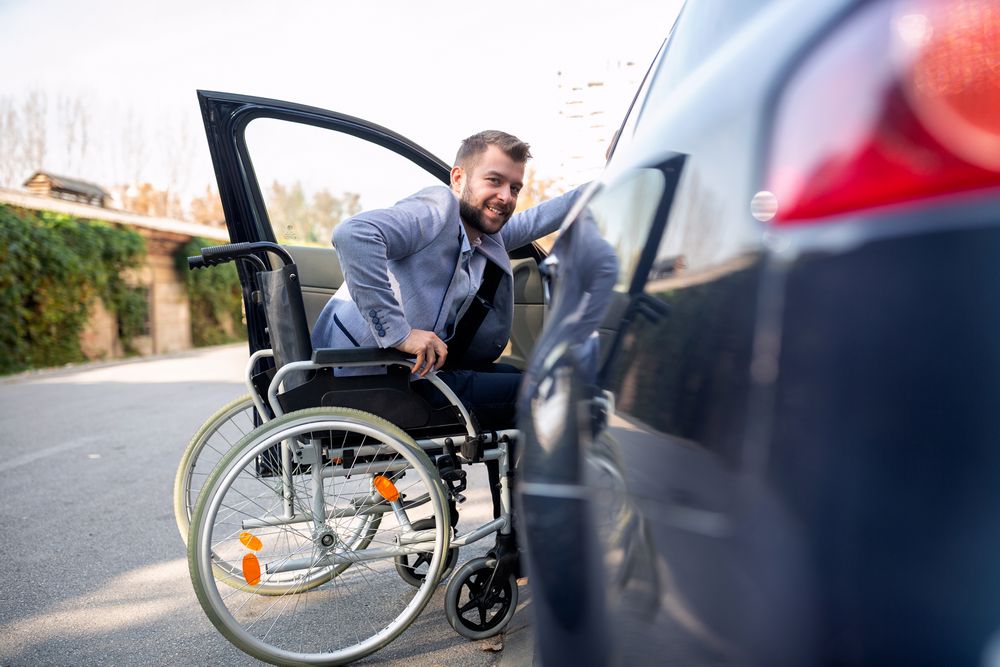 Man attempting to get in the car in the disabled parking zone